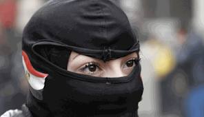 Masked militant black bloc participant at rally in Cairo, Jan 25, 2013.