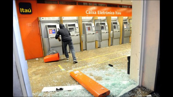 A  protester rushes to make a last minute cash withdrawal...