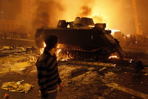 An Egyptian Army armoured personnel carrier burns during clashes in January 2013.